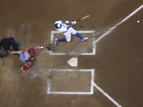 Milwaukee Brewers' Keon Broxton hits an RBI single during the second inning of a baseball game against the Philadelphia Phillies Friday, July 14, 2017, in Milwaukee. (AP Photo/Morry Gash)