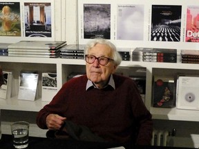 FILE - In this file photo dated Tuesday, Oct. 14, 2014, 97-year old former Life Magazine, New York Times and Washington Post picture editor John Morris during an interview in New York City.  The renowned picture editor who's pictorial judgement impacted on public understanding of seminal stories for decades including World War II and the Vietnam War, John G. Morris has died aged 100, Friday July 28, 2017, at a hospital near his home in Paris. (AP Photo/Harry Hamburg, FILE)