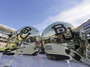 FILE - In this Dec. 5, 2015 file photo, Baylor helmets on shown the field after an NCAA college football game in Waco, Texas. The Education Department's civil rights chief says she's sorry for making "flippant" remarks attributing 90 percent of campus sexual assault claims to both parties being drunk. Baylor University will look to rebuild its reputation and perhaps its football program after an outside review found administrators mishandled allegations of sexual assault and the team operated under the perception it was above the rules. (AP Photo/LM Otero, File)