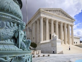 In this photo taken March 28, 2017, the Supreme Court Building is seen in Washington. The Supreme Court is granting the Trump administration's request to more strictly enforce its ban on refugees, at least until a federal appeals court weighs in. But the justices are leaving in place a lower court order that makes it easier for travelers from six mostly Muslim countries to enter the U.S.  (AP Photo/J. Scott Applewhite)