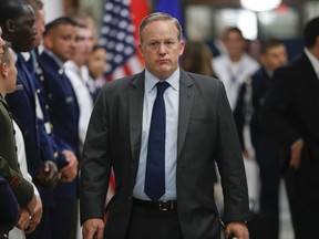 White House press secretary Sean Spicer walks down the hallway during President Donald Trump's visit to the Pentagon, Thursday, July 20, 2017.   White House Press Secretary Sean Spicer has resigned over hiring of new communications aide.  (AP Photo/Pablo Martinez Monsivais)