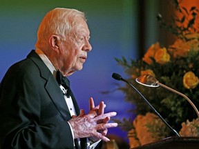 In this Jan. 27, 2017 file photo, former President Jimmy Carter speaks in Phoenix. Carter has been treated for dehydration while volunteering with Habitat for Humanity in Winnipeg.