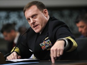 FILE - In this May 9, 2017, file photo, U.S. Cyber Command and the National Security Agency Director Adm. Mike Rogers testifies on Capitol Hill in Washington. U.S. officials say the Trump administration, after months of delay, is finalizing plans to revamp the nation's military command for defensive and offensive cyber-operations. The plan would eventually split it from the intelligence-focused National Security Agency in hopes of intensifying America's ability to wage cyber war against the Islamic State group and other foes. (AP Photo/Jacquelyn Martin, File)