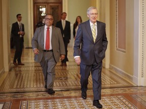 FILE - In this July 13, 2017 file photo, Senate Majority Leader Mitch McConnell of Ky. walks to his office on Capitol Hill in Washington. Republicans' latest health care plan would create winners and losers among Americans up and down the income ladder, and across age groups. (AP Photo/Pablo Martinez Monsivais, File)