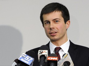 FILE - In this March 18, 2013 file photo, South Bend Mayor Peter Buttigieg speaks to reporters about a plane crash in South Bend, Ind. Republicans are fending off questions about Russia and the Trump campaign, and dealing with an unpopular health care plan. But Democrats have yet to unify behind a clear, core message that will help them take advantage of their opponents' struggles. (AP Photo/Joe Raymond, File)