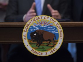 FILE - In this March 29, 2017 file photo, Interior Secretary Ryan Zinke speaks at the Interior Department in Washington.  The Senate is on track to confirm President Donald Trump's nominee for the No. 2 job at the Interior department over Democratic objections. David Bernhardt is a former lobbyist who once sued the department, hardly a fit with Trump's call to drain the swamp.  (AP Photo/Molly Riley)