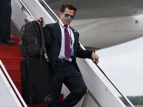 In this July 28, 2017 photo, White House communications director Anthony Scaramucci walks down the steps of Air Force One after arriving at Long Island MacArthur Airport in Ronkonkoma, for a speech by President Donald Trump on the street gang MS-13. Scaramucci is out as White House communications director after just 11 days on the job.  A person close to Scaramucci confirmed the staffing change just hours after President Donald Trump's new chief of staff, John Kelly, was sworn into office.  (AP Photo/Evan Vucci)