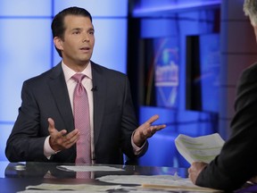 FILE - In this July 11, 2017 file photo, Donald Trump Jr., left, speaks in New York. A lawyer for a Russian developer says a company representative was the eighth person at a Trump Tower meeting brokered by Donald Trump Jr. during the campaign. (AP Photo/Richard Drew, File)