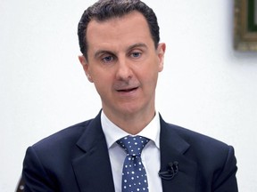 FILE - In this photo released by the Syrian official news agency SANA, Syrian President Bashar Assad, speaks during an interview with Hong-Kong based Phoenix TV in Damascus, Syria, March 11, 2017. The U.S. is seeking a political resolution to the crisis in Syria and doesn't insist on Assad's immediate ouster, President Donald Trump's homeland and counterterrorism adviser said July 20, 2017. "I don't think it's important for us to say Assad must go first," Tom Bossert said at the Aspen Security Forum, an annual gathering of intelligence and national security officials and experts.(SANA via AP)