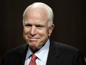 FILE - In this July 11, 2017, file photo, Sen. John McCain, R-Ariz., arrives on Capitol Hill in Washington. McCain has been diagnosed with a brain tumor after a blood clot was removed. (AP Photo/Jacquelyn Martin, File)