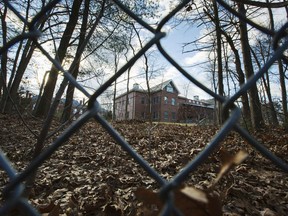 FILE - In this Dec. 30, 2016, file photo, a fence encloses an estate in the village of Upper Brookville in the town of Oyster Bay, N.Y., on Long Island. Resolving a dispute over Russian diplomatic compounds the U.S. seized last year could help repair relations between Washington and Moscow. After Russia meddled in the presidential election, the Obama administration expelled 35 Russian officials from the U.S. and shut down two Cold War-era recreational estates, which President Barack Obama said were being used for spy operations. (AP Photo/Alexander F. Yuan, file)
