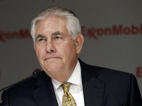 FILE - In this May 28, 2014 file photo, ExxonMobil CEO Rex Tillerson listens to a reporter's question after the annual meeting ExxonMobil shareholders meeting in Dallas.   The Treasury Department hit Exxon Mobil Corp. with a $2 million fine Thursday for violating Russia sanctions while Secretary of State Rex Tillerson was the oil company's CEO.   (AP Photo/LM Otero, File)