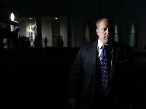 FILE - In this May 9, 2017, file photo, White House press secretary Sean Spicer walks from the West Wing of White House, in Washington to speak to reporters after President Donald Trump abruptly fired FBI Director Comey. Almost from Day One, it was clear that Sean Spicer would ride a uniquely rocky and humiliating road as President Donald Trump's White House press secretary. (AP Photo/Carolyn Kaster, File)