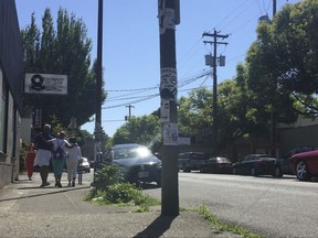 In this photo taken July 6, 2017, from left, Ron Young, Sharon Steen and Gahlena Easterly reminisce as they take a mile-long walk through North Portland, Oregon, streets that once were full of black-owned homes and businesses. Researchers are studying whether jogging memories where they were made can help African-American seniors stay sharp and slow early memory loss.  (AP Photos/Gillian Flaccus)