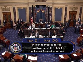 In this image from video provided by C-SPAN2, the final Senate vote, with Vice President Mike Pence's vote, to start debate to tear down much of the Obama health care law, Tuesday, July 25, 2017, on the floor of the Senate on Capitol Hill in Washington.  (C-SPAN2 via AP)