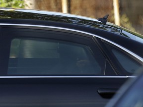 Spain's Prime Minister Mariano Rajoy, left, arrives by car at Spain's National Court in San Fernando de Henares, outside Madrid, Wednesday, July 26, 2017. Rajoy appears as a witness in the trial of 37 people involved in an alleged kickbacks-for-contracts scheme that helped finance his ruling Popular Party. (AP Photo/Francisco Seco)