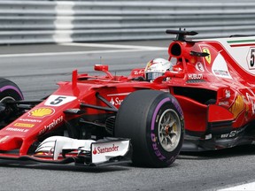 Ferrari driver Sebastian Vettel of Germany steers his car during the Austrian Formula One Grand Prix at the Red Bull Ring in Spielberg, Austria, Sunday, July 9, 2017. (AP Photo/Darko Bandic)