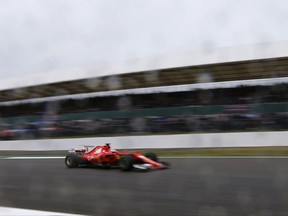 Ferrari driver Sebastian Vettel of Germany steers his car during the third free practice session for the British Formula One Grand Prix at the Silverstone racetrack in Silverstone, England, Saturday, July 15, 2017. The British Formula One Grand Prix will be held on Sunday, July 16. (AP Photo/Frank Augstein)