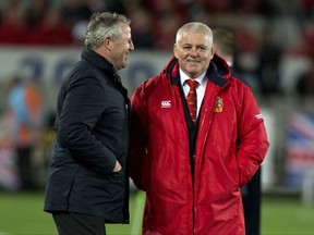 British and Irish Lions head coach Warren Gatland, right, talks with former All Black captain Sean Fitzpatrick ahead of the third and final rugby test between the British and Irish Lions and the All Blacks at Eden Park in Auckland, New Zealand, Saturday, July 8, 2017. (AP Photo/Mark Baker)