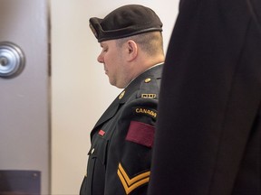 Cpl. Garett Rollman, a Canadian Armed Forces reservist, arrives at a military court in Kentville, N.S. on Monday, July 31, 2017. Rollman a reservist who allegedly made a racial slur towards a civilian kitchen worker and struck his superior officer is facing a court martial today in Nova Scotia. THE CANADIAN PRESS/Andrew Vaughan