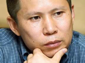 FILE - In this July 17, 2009, file photo, legal scholar Xu Zhiyong is seen at a meeting in Beijing, China. Zhang Qingfang, Xu's attorney, said he was freed Saturday, July 15, 2017, from a prison in Beijing at the end of a four-year sentence imposed on him after he founded a loose network of socially conscious campaigners. (AP Photo/Greg Baker, File)