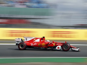 Ferrari driver Sebastian Vettel of Germany steers his car during the the first practice at the British Formula One Grand Prix free practice at the Silverstone racetrack, Silverstone, England, Friday, July 14, 2017. The British Formula One Grand Prix will be held on Sunday July 16. (AP Photo/Frank Augstein)