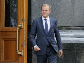 European Council President Donald Tusk walk to joint press conference with Ukrainian President, Petro Poroshenko and European Commission President Jean-Claude Juncker in Kiev, Ukraine, Thursday, July 13, 2017. (AP Photo/Efrem Lukatsky)