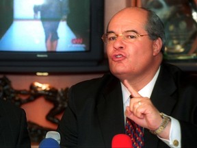 FILE - In this March 25, 2002 file photo, then-political consultant Julio Ligorria speaks to reporters in Guatemala City, Guatemala, regarding accusations made by Guatemalan President Alfonso Portillo that he and others were planning to destabilize the Guatemalan and Panamanian governments. A Guatemalan judge issued arrest warrants for the former ambassador to the United States and another top ex-official in connection with a wide-ranging graft investigation, announced on July 12, 2017 by an U.N. anti-corruption commission. (AP Photo/Moises Castillo, File)