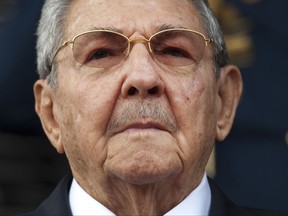 FILE - In this March 17, 2015 file photo, Cuba's President Raul Castro listens to the playing of national hymns during his welcome ceremony at Miraflores presidential palace before the start of an emergency ALBA meeting in Caracas, Venezuela. Castro called President Donald Trump's new policy on Havana a setback for Cuba-U.S. relations on Friday, July 14, 2017, but said he was willing to continue normalizing ties on a basis of mutual respect. (AP Photo/Ariana Cubillos, File)