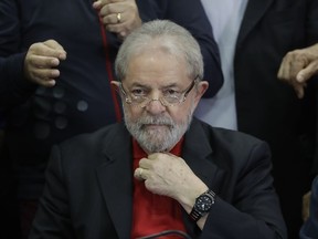 FILE - In this July 13, 2017 file photo, former Brazilian President Luiz Inacio Lula da Silva prepares to speak to the press and supporters at the headquarters of the Worker's Party, in Sao Paulo, Brazil. A Brazilian judge said on Wednesday, July 19, 2017 bank accounts belonging to the ex-president have been frozen due to his conviction on corruption charges. (AP Photo/Andre Penner, File)