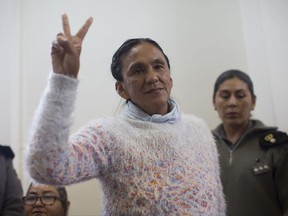 FILE - In this Dec. 28, 2016 photo, activist Milagro Sala flashes the victory sign before being given a guilty verdict at a courtroom in San Salvador de Jujuy, in the northern Argentine province of Jujuy. The Inter-American Commission on Human Rights recommended Friday, July 28, 2017, that the Argentine government release Sala from prison and let her serve out the rest of her term under house arrest or by electronic monitoring. (AP Photo/Gianni Bulacio, File)