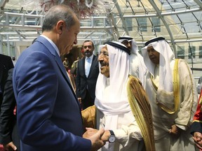Turkey's President Recep Tayyip Erdogan, left, talks with Emir of Kuwait Sheikh Sabah Al Ahmad Al Sabah during his departure ceremony in Kuwait City, Kuwait, Monday, July 24, 2017. Erdogan later flew to Qatar on the final leg of a Gulf two-day tour, which also took him to already took him to Saudi Arabia, aimed at forging a resolution to the diplomatic standoff gripping the Gulf nation and four fellow Arab countries (Presidency Press Service/Pool Photo via AP)