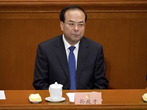 In this March 13, 2017 photo, the then-party secretary of Chongqing, Sun Zhengcai, attends a plenary session of China's National People's Congress (NPC) at the Great Hall of the People in Beijing. A Chinese politician considered a potential future leader has been replaced as head of the central mega-city of Chongqing amid reports he is facing a graft investigation. The Chongqing government said on its website Saturday, July 15, 2017, that Sun Zhengcai was being replaced as head of the city's Communist Party committee by Chen Min-er. (AP Photo/Mark Schiefelbein)