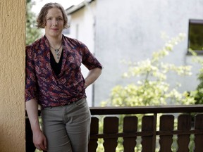 In this July 29, 2017 photo transgender U.S. army captain  Jennifer Sims stands on a balcony after  an interview with The Associated Press in Beratzhausen near Regensburg, Germany.  (AP Photo/Matthias Schrader)