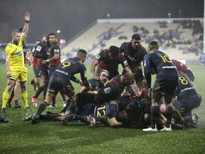 Referee Angus Gardner, left, awards a try to the Canterbury Crusaders during their Super Rugby quarterfinal against the Highlanders in Christchurch, New Zealand, Saturday, July 22, 2017. (AP Photo/Mark Baker)