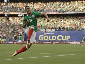 Mexico's Elias Hernandez celebrates after scoring a goal against El Salvador during a CONCACAF Gold Cup soccer match in San Diego, Sunday, July 9, 2017. Mexico won the match 3-1. (AP Photo/Gregory Bull)