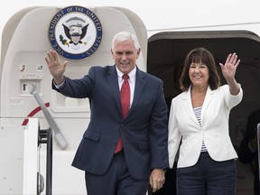 U.S. Vice President Mike Pence and his wife Karen Pence wave as they arrive at the airport in Tallinn, Estonia, Sunday, July 30, 2017. Pence arrived in Tallinn for a two day visit where he will meet Baltic States leaders to discuss regional security issues as well as economic and political topics. (AP Photo/ Mindaugas Kulbis)