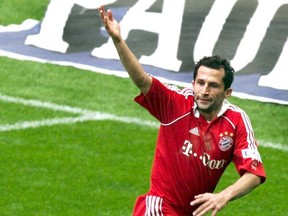 In This March 31, 2007 file photo Hasan Salihamidzic of Munich cheers while scoring  during the Bundesliga soccer match between  FC Bayern Munich and FC Schalke 04  in  Munich, Germany.  According to German dpa news agency, on Monday, July 31, 2017, Salihamidzic will become sports director of Bayern Munich soccer club.  (AP Photo/ Matthias Schrader,File)