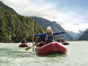 In this April 18, 2017, photo supplied by the Tourism New Zealand, United States actress Bryce Dallas Howard reacts as she enjoys a kayak trip down the Dart River in the Mt. Aspiring National Park, in New Zealand. Howard says her enthusiasm for New Zealand hasn't dimmed since she first visited at age 5 and was so stunned by the scenery she felt like she'd been transported to some other planet. The actress this week begins a campaign to promote the South Pacific nation as a tourist destination to Americans and Canadians. (Tourism New Zealand via AP)