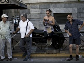 Protester gather to take part in protest by tourism and catering workers in central Athens, Thursday, July 20, 2017. Unions representing workers in the two sectors called a 24-hour strike Thursday to protest lax enforcement of labor laws. Despite tourism being a major money earner for the crisis-hit country, unions say tourism and catering workers are among the lowest paid in Greece and job protection regulations frequently ignored.(AP Photo/Petros Giannakouris)