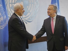 United Nations Secretary-General Antonio Guterres, right, and Iran's Foreign Minister Javad Zarif exchange hand-shakes before their meeting, Monday July 17, 2017, at U.N. headquarters. (AP Photo/Bebeto Matthews)