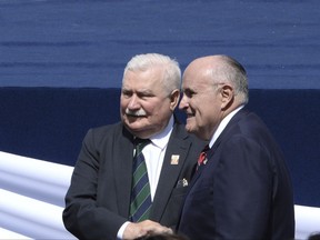 Former New York Mayor Rudolph Giuliani, right, poses for a photograph with Poland's former president and legendary Solidarity freedom movement founder Lech Walesa, prior to U.S. President Donald Trump's speech in Krasinski Square, in Warsaw, Poland, Thursday, July 6, 2017.(AP Photo/Alik Keplicz)