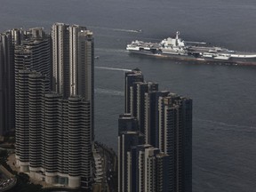 The Liaoning, China's first aircraft carrier, sails into Hong Kong for a port call, Friday, July 7, 2017, to celebrate the 20th anniversary of the People's Liberation Army (PLA) garrison's presence in the semi-autonomous Chinese city and former British colony.