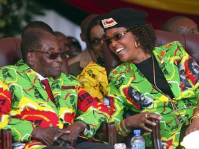 In this Friday June, 2, 2017 photo, Zimbabwe President Robert Mugabe and his wife Grace attend a youth rally in Marondera, about 100 km east of Harare.