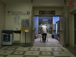 A man with a walker enters the Royal Victoria Hospital's emergency room in Montreal in April 2015. The majority of the hospital's services and patients were moved to the MUHC's Glen site on April 26, 2015.