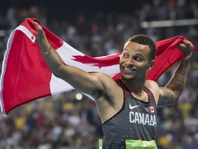 In this Aug. 14, 2016 file photo, Andre De Grasse celebrates his 100-metre bronze medal at the Rio Olympics.