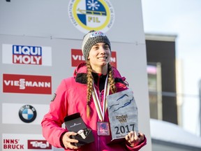 Kimberley McRae poses for photos after finishing third at the world championships in Innsbruck, Austria, on Jan. 28.