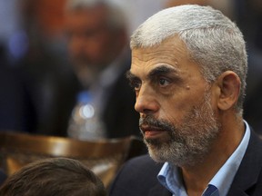 In this May 1, 2017 file photo, Yehiyeh Sinwar, a top Hamas official in Gaza attends a news conference in Gaza City.