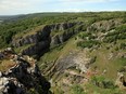 A general view of Cheddar Gorge in a 2011 file photo. New research has revealed cave dwellers in the area filleted and ate dead relatives before inscribing markings on their bones in grisly rituals.