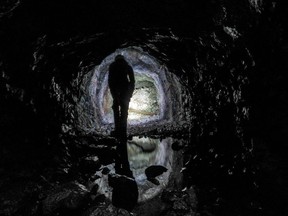 A member of the Nova Scotia Minehunters ventures into a mine.